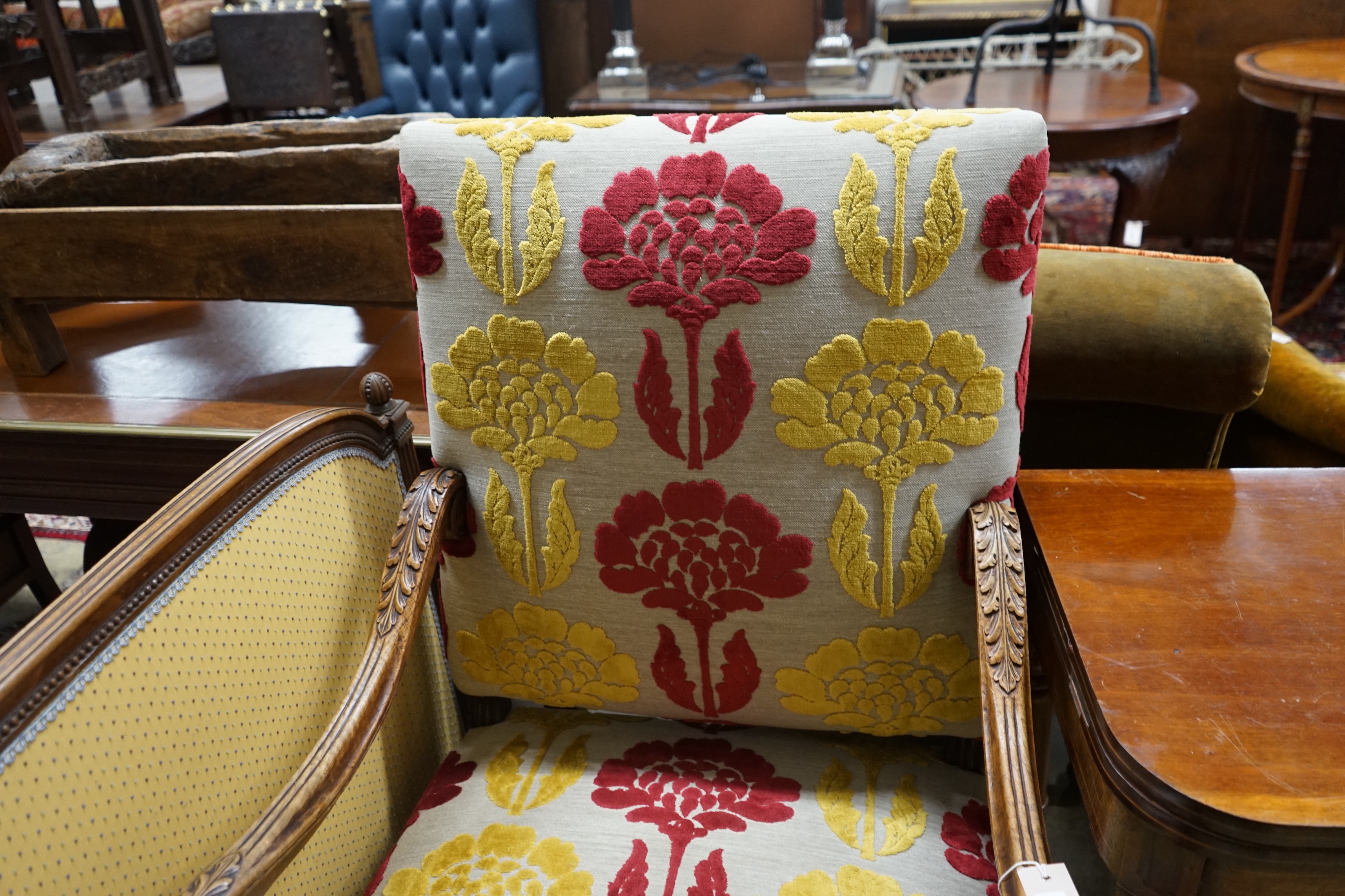 An upholstered Carolean style armchair, width 65cm, depth 56cm, height 114cm